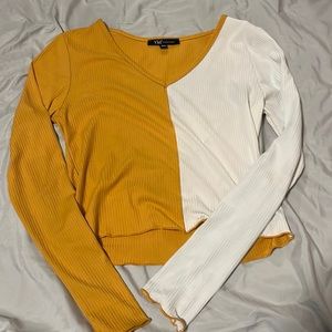 A YMI collections XL, cropped, long sleeve, half white, half yellowish orange.